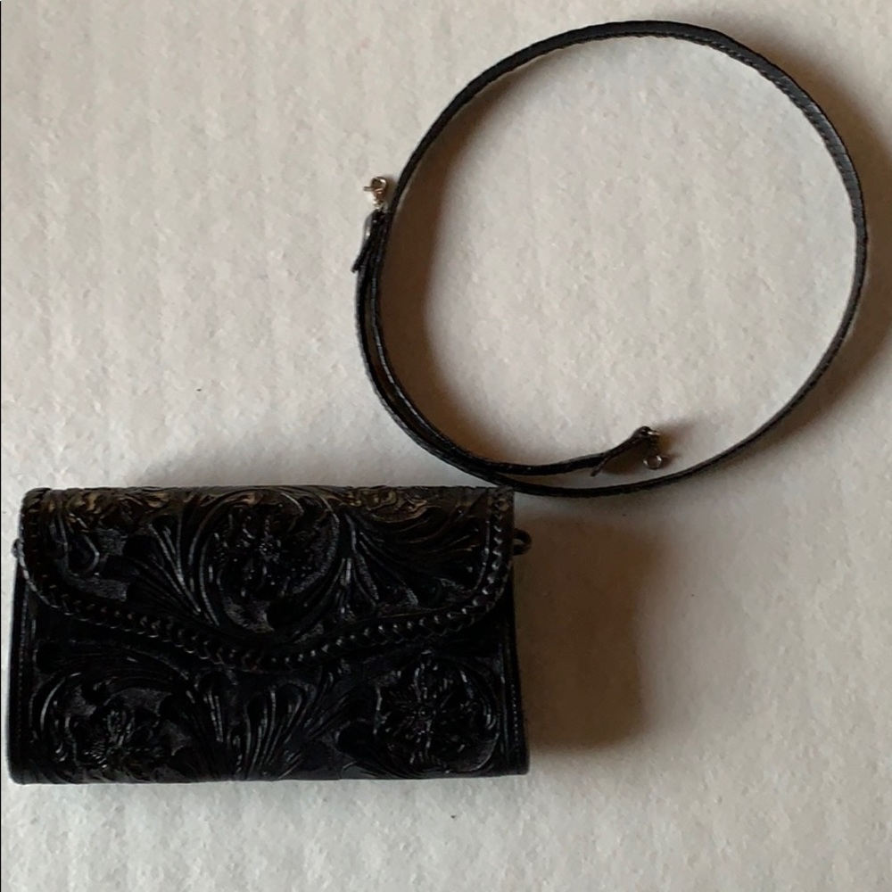 Beautifully tooled leather clutch. Like New.